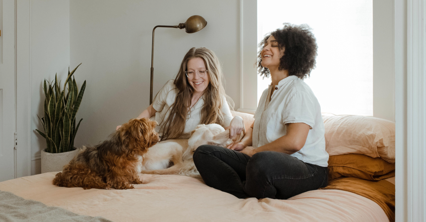Women and Dog on Bed